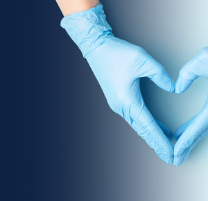 Gloved hand forming a heart shape